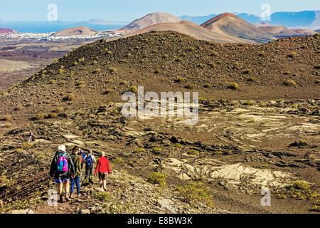 Walkers Crossing Volcanic Landscape Lanzarote Canary Islands Stock Photo