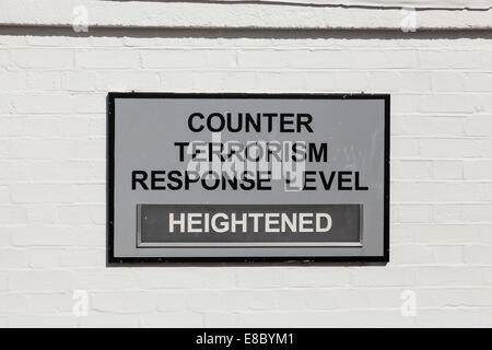 Wall mounted counter terrorism response level sign displaying level as 'heightened'. Stock Photo