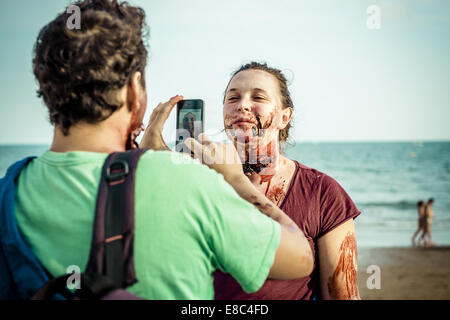 Sitges, Spain. 4th Oct, 2014. Zombies photograph each other with their smart phone in front of the Sitges Zombie Walk 2014 Credit:  Matthias Oesterle/ZUMA Wire/ZUMAPRESS.com/Alamy Live News
