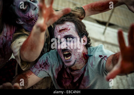 Sitges, Spain. 4th Oct, 2014. Zombies advance on the camera at the Sitges Zombie Walk 2014 Credit:  Matthias Oesterle/ZUMA Wire/ZUMAPRESS.com/Alamy Live News