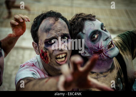 Sitges, Spain. 4th Oct, 2014. Zombies advance on the camera at the Sitges Zombie Walk 2014 Credit:  Matthias Oesterle/ZUMA Wire/ZUMAPRESS.com/Alamy Live News