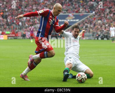 Beijing, Germany. 4th Oct, 2014. Bayern Munich's Arjen Robben (L) vies for the ball during the German first division Bundesliga football match against Hannover in Munich, Germany, on Oct. 4, 2014. Bayern Munich won 4-0. Credit:  Philippe Ruiz/Xinhua/Alamy Live News