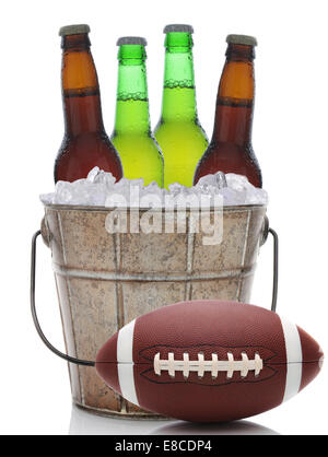 Closeup of an old fashioned beer bucket with three green bottles of cold beer and an American Football. Isolated on white with r Stock Photo