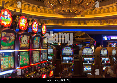 Slotmachines in a casino in Las Vegas with a car in background Stock Photo