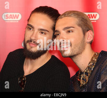Magdeburg, Germany. 5th Oct, 2014. HANDOUT - The twin brothers Bill Kaulitz (R) and Tom Kaulitz of the band 'Tokio Hotel' pose at a listeners' concert at the Radio SAW station in Magdeburg (Saxony-Anhalt), Germany, 05 October 2014. Credit:  dpa picture alliance/Alamy Live News Stock Photo
