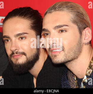 Magdeburg, Germany. 5th Oct, 2014. HANDOUT - The twin brothers Bill Kaulitz (R) and Tom Kaulitz of the band 'Tokio Hotel' pose at a listeners' concert at the Radio SAW station in Magdeburg (Saxony-Anhalt), Germany, 05 October 2014. Credit:  dpa picture alliance/Alamy Live News Stock Photo