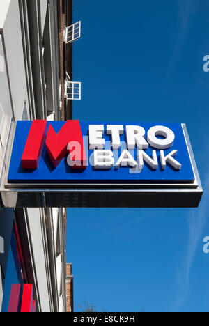 hanging sign for a branch of metro bank, kensington high street, london, england Stock Photo