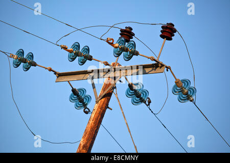 Telegraph pole with glass suspension discs on the western coast of Holy Island part of the Isle of Anglesey (Sir Ynys Mon) North Stock Photo