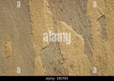Rough yellow sandstone slab as abstract background texture Stock Photo