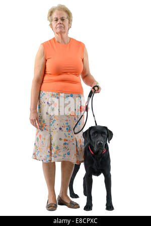 Woman with black labrador retriever dog on leash cut out isolated on white background Stock Photo