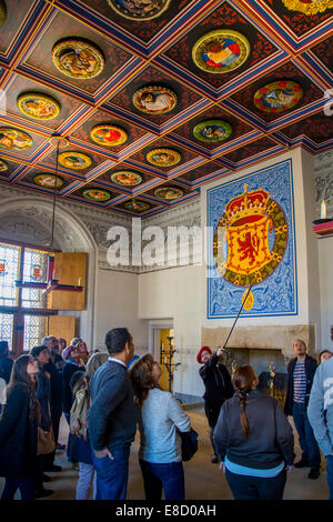 Tourists learn history lesson inside the King's inner chamber from a costumed actor, Stirling Castle, Stirling, Scotland Stock Photo