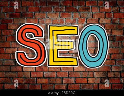 SEO and Brick Wall in the Background Stock Photo