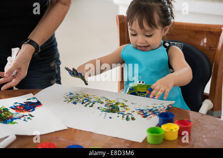 child finger painting Stock Photo
