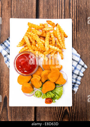 Chicken Nuggets with French Fries (detailed close-up shot) Stock Photo