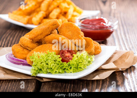 Chicken Nuggets with French Fries (detailed close-up shot) Stock Photo