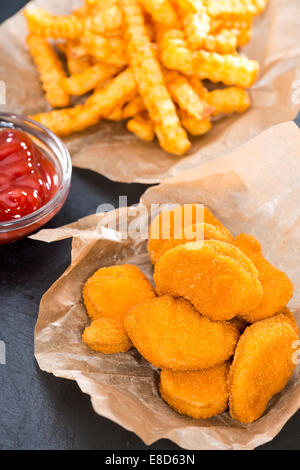 Chicken Nuggets with French Fries (detailed close-up shot) Stock Photo