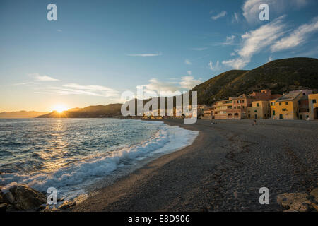 Typical houses on the beach at sunset, Varigotti, Finale Ligure, Riviera di Ponente, Liguria, Italy Stock Photo