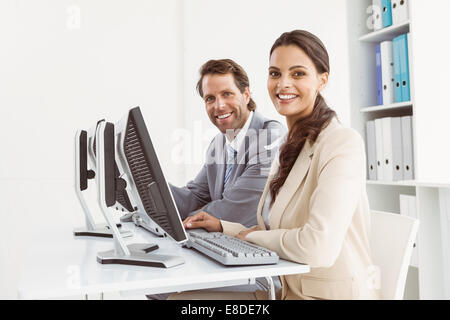 Business people using computers in office Stock Photo