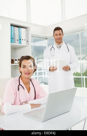 Confident doctors at medical office Stock Photo