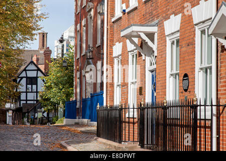 Early 19th century town houses in Priory Row and the timber-framed Lychgate Cottages, Coventry, Warwickshire, England, UK Stock Photo