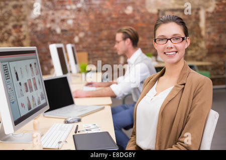 Photo editors using computers in office