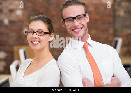 Two smiling business colleagues in office Stock Photo