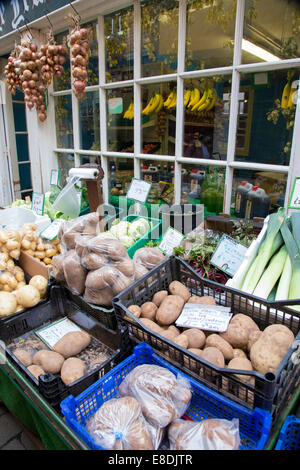 Fruit and vegetables on sale outside shop. England, UK Stock Photo