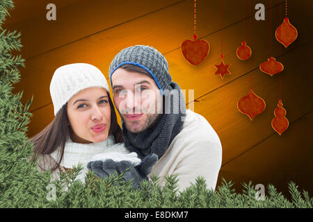 Composite image of young winter couple Stock Photo