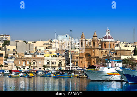 Malta, Marsaxlokk: Panoramic view of the Malta's most photographed picturesque harbour with the church of Our Lady of Pompeii. Stock Photo