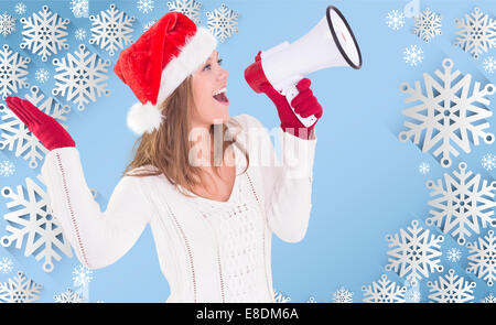 Composite image of festive blonde shouting through megaphone