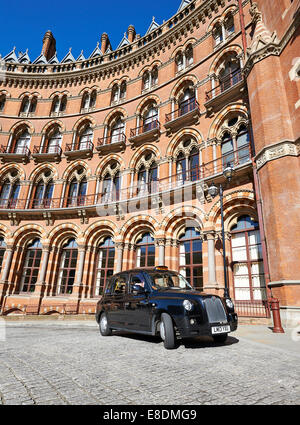 LONDON - JUNE 08 : A London Taxi or 'Black Cab' at St.Pancras on June 08, 2014 in London, UK. All London cabs undergo a strict a Stock Photo