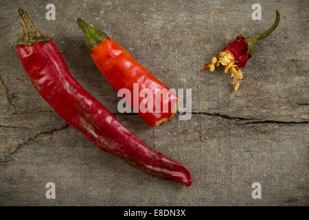 Dried red chilli peppers on a wood table Stock Photo