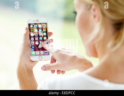 Girl using an iPhone6 Stock Photo