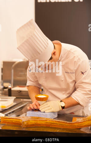 Earls Court, London UK. 6th October 2014. The Restaurant Show opening day. Competition Kitchen holds the 1st UK Sugar Championship Junior Trophy 2014. Felicien Christe of The Savoy in London seen here creating his sugar sculpture. Credit:  Malcolm Park editorial/Alamy Live News. Stock Photo