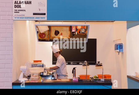 Earls Court, London UK. 6th October 2014. The Restaurant Show opening day. Competition Kitchen holds the 1st UK Sugar Championship Junior Trophy 2014. Alannah Doe from The Address in Dubai creating her sugar sculpture. Credit:  Malcolm Park editorial/Alamy Live News. Stock Photo
