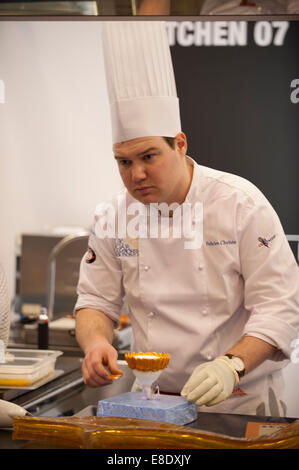 Earls Court, London UK. 6th October 2014. The Restaurant Show opening day. Competition Kitchen holds the 1st UK Sugar Championship Junior Trophy 2014. Felicien Christe of The Savoy in London creating his sugar sculpture. Credit:  Malcolm Park editorial/Alamy Live News. Stock Photo