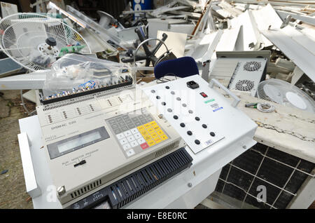 End of the line for operational office machinery now waiting to be scrapped for scrap metal in scrapyard recycling reclaiming Stock Photo