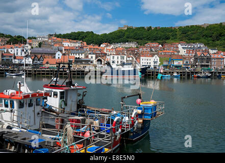 Fishing boat boats in summer Scarborough Harbour port seafront seaside resort town North Yorkshire England UK United Kingdom GB Great Britain Stock Photo