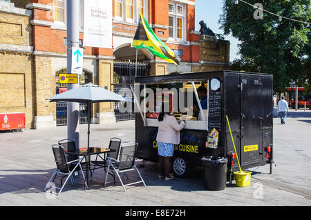 Caribbean food stand at Woolwich market London England United Kingdom UK Stock Photo