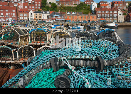 Close up of fishing nets and lobster crab pots equipment on the quayside in summer Whitby North Yorkshire England UK United Kingdom GB Great Britain Stock Photo