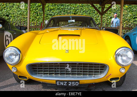 Classic vintage yellow 1960 Ferrari 250 GT SWB/C racing car at the Goodwood Revival 2014, West Sussex, UK Stock Photo