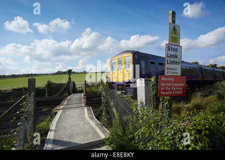 Walkers using a railway foot crossing near Eynsford, Kent, UK. Stock Photo