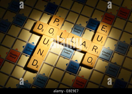 Scrabble board with the words Pound Dollar Euro Stock Photo
