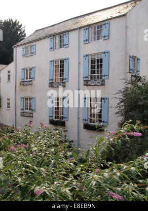Three storey house with blue shutters on the windows, Lyme Regis, Dorset, UK Stock Photo