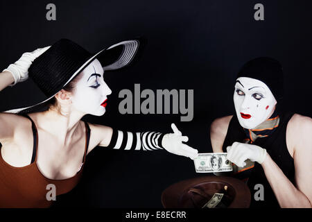 Portrait of two mimes on a black background Stock Photo