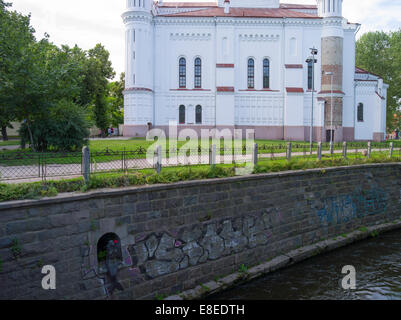 View of the mermaid in the wall along the Vilniau River, with graffiti; Vilnius, Lithuania Stock Photo