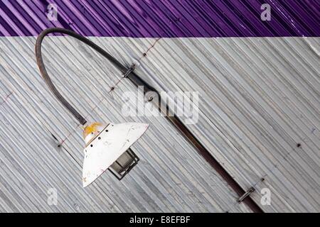 Abstract image of a lamp on the side of a building Stock Photo