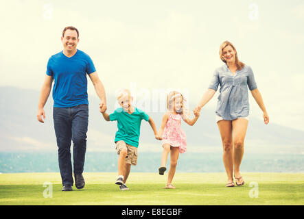 Portrait of Happy Family of Four Outside Stock Photo