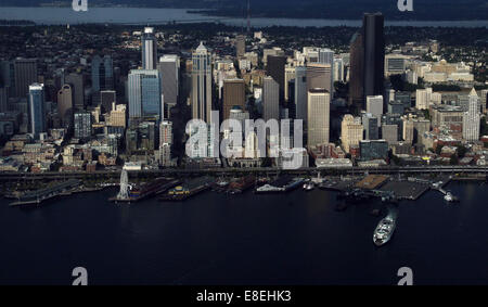 A beautiful dramatically lit photograph of the Seattle skyline from about 1,000 feet high over Elliot Bay part of the Salish Sea in WA State, USA. Stock Photo