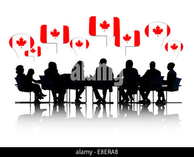 Talking Business People Silhouettes Isolated On White With Canadian Flag Speech Bubble Stock Photo